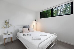 In the bedroom, there is a comfortable queen-sized bed topped with premium, hotel-style linens. There is plenty of storage space for your belongings.
