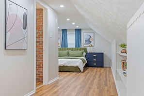 Room to relax and unwind in a spacious bedroom.