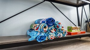 Beach towels and board games for fun and relaxation.