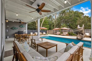 Enjoy its unique layout designed for the comfort of a big group, including a fenced yard with a pool, hot tub and a firepit.