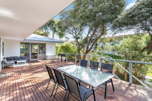 Savor serene views and fresh air on our inviting outdoor deck