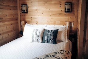 Serene Bedrooms: Retreat to two comfortable bedrooms, each furnished with a queen bed, closet, dresser, and ceiling fan.