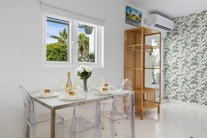 Enjoy dining with a stylish 4-seat table in a modern, fully air-conditioned space.
