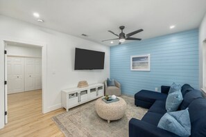 Seamless flow from the cozy living area to the bedroom.