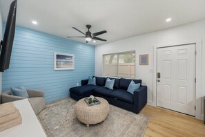 Stylish and inviting living room with a cozy sectional and soothing natural light!