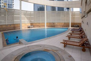 Cool off and refresh in the inviting communal pool, an ideal spot to relax and socialize.