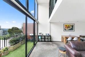 Private terrace with views, high ceilings.