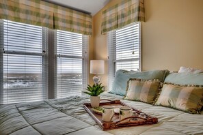 A breakfast tray on the master bed, perfect for enjoying coffee or breakfast in bed while soaking in the stunning views.