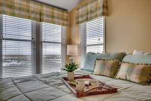 A breakfast tray on the master bed, perfect for enjoying coffee or breakfast in bed while soaking in the stunning views.