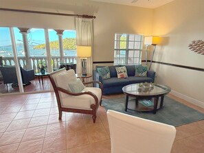 Your cozy living area opens to a covered balcony