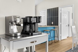 Start your morning at Sunsetora's coffee bar, featuring espresso and Keurig Duo