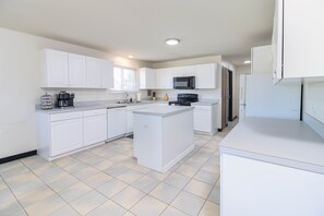 This modern kitchen is both functional and stylish, perfect for cooking up delicious meals.
