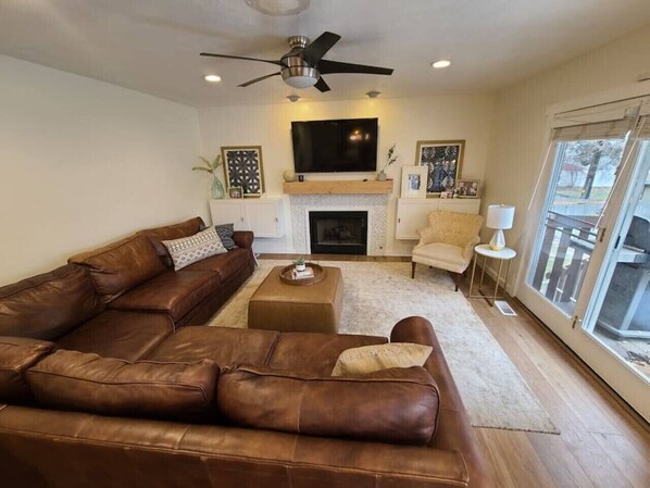 Spacious Living Room with Amazing couch and beautiful natural lighting