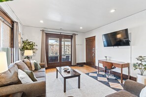 Living room with view of french doors that lead to our spacious covered patio.