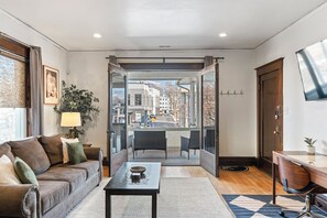 Living room with Sofa Sleeper, French doors leading to our spacious patio.
