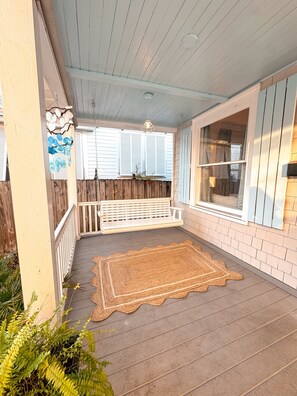 Charming front porch with a swing — perfect for morning coffee or sunsets.