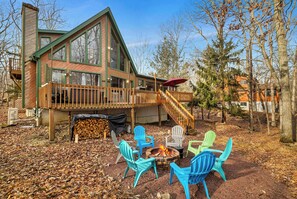 Outdoor Retreat: Gather around the firepit with colorful chairs for unforgettable moments under the stars!
