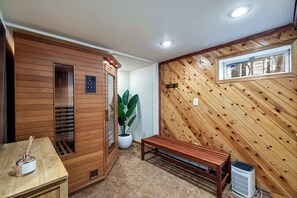 Relax and rejuvenate in this private sauna, featuring warm natural wood accents and a calming atmosphere—your perfect retreat to unwind!