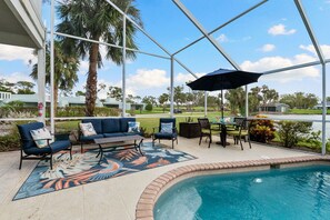 Enjoy meals under the open sky with a beautiful outdoor dining area on the patio.