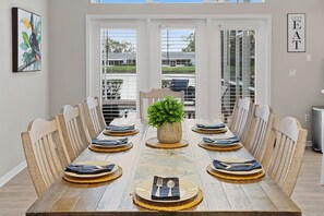 Gather around the dining table for 8, perfectly positioned to enjoy beautiful golf course views.