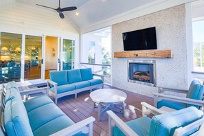 Your family will love to gather together on the home's expansive screened porch.