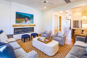 The home features high ceilings, beautiful light fixtures, shiplap walls and all new furniture.