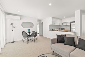 Beautiful open concept apartment, cook in the kitchen and enjoy ease to the dining area and living area, watch your SMART TV etc. 