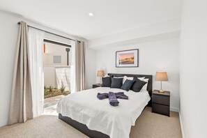 Queen bed in your bedroom #2,  with a side patio for fresh air and natural light.