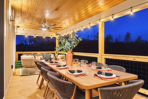 Start your morning with coffee on the top deck, where a dining table for 10, a BBQ, and a cozy seating area overlook breathtaking mountain views.