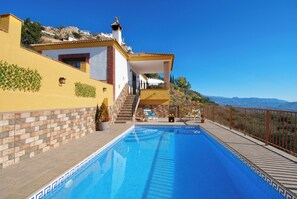 The pool area is fenced and has magnificant views.