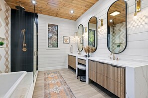 Luxuriate in the primary ensuite featuring dual showerheads and a stunning free-standing tub. Treat yourself to a bath soak or a shower bomb and turn every moment into pure relaxation.