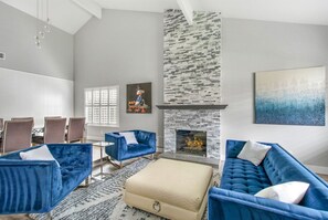 Living room with comfortable couch seating and gas fireplace