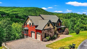 This spacious, gorgeous home with a panoramic view has parking for 6 cars.