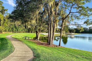 Enjoy peaceful strolls by the lake with lush greenery, picnic tables, and tranquil surroundings—ideal for unwinding or morning coffee.