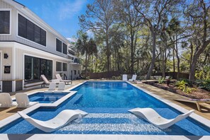 Dive into shimmering pool waters and spent lazy days soaking the sun on the tanning ledge