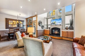 Cozy up by the fire in the beautiful living room
