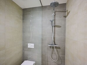 Flooring, Bathroom, Floor, Shower Head, Plumbing Fixture, Interior Design, Shower, Shower Bar, Tile, Shower Panel