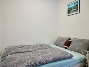 Bedroom, Bed, Bed Sheet, Linens, Bedding, Floor, Interior Design, Furniture, Room, Flooring