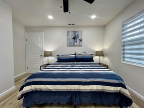 Bedroom #1 - King Bed, Ceiling Fan, and SmartTV
