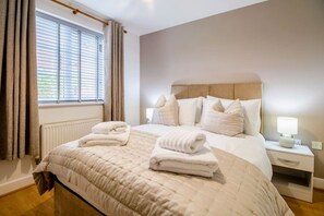 Bedroom 1 - Double bed with fresh linen and towels provided.