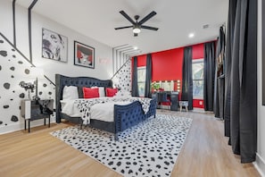 Cruella-Inspired Master Bedroom: Immerse yourself in bold elegance with black-and-white Dalmatian decor, pops of red, and glamorous touches that redefine luxury. #CruellaTheme #DisneyInspiredStay #LuxuryVacationRental #BoldDecor #ThemedStayATL