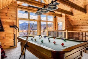 Game Room with an incredible view and all of the guest favorites like pool table, arcade games, boss toss