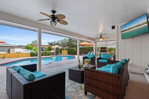 Your Poolside Sanctuary! Experience the best of outdoor living with a cozy lounge area by the pool, designed for relaxation and enjoyment.
