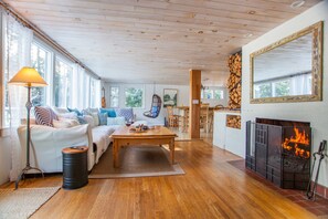 Living room with wood burning fireplace