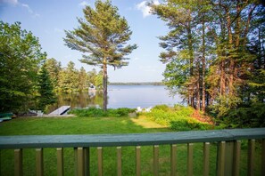 Enjoy dinner on the deck overlooking the yard and lake