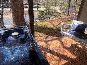 Covered patio hot tub w/ River View