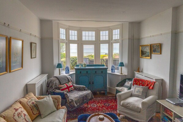 Sea views from the lounge, comfortable chairs make this room a delightful place to relax, chat, watch TV or fire up the log burner.