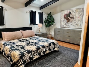 Retreat to the spacious master suite featuring a king-sized bed and private in-room bathtub.