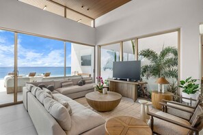 Relax in style with a plush sofa that invites comfort and luxury in this inviting living room — the perfect spot to unwind and entertain.