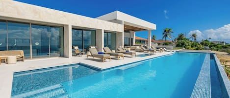 Modern villa with a stunning infinity pool, ideal for a luxurious vacation.